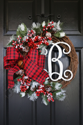 B Style Christmas monogram wreath with plaid bow, berries, pinecones, and greenery