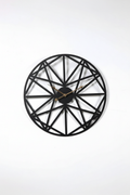 Modern black wrought iron wall clock with geometric face